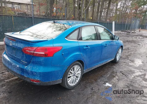 2017 Ford Focus Titanium z USA, uszkodzony, nr VIN 1FADP3J2XHL264244